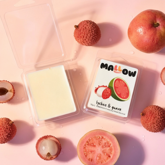 Mallow lychee & guava soap bar with lychees and guava on a pink background